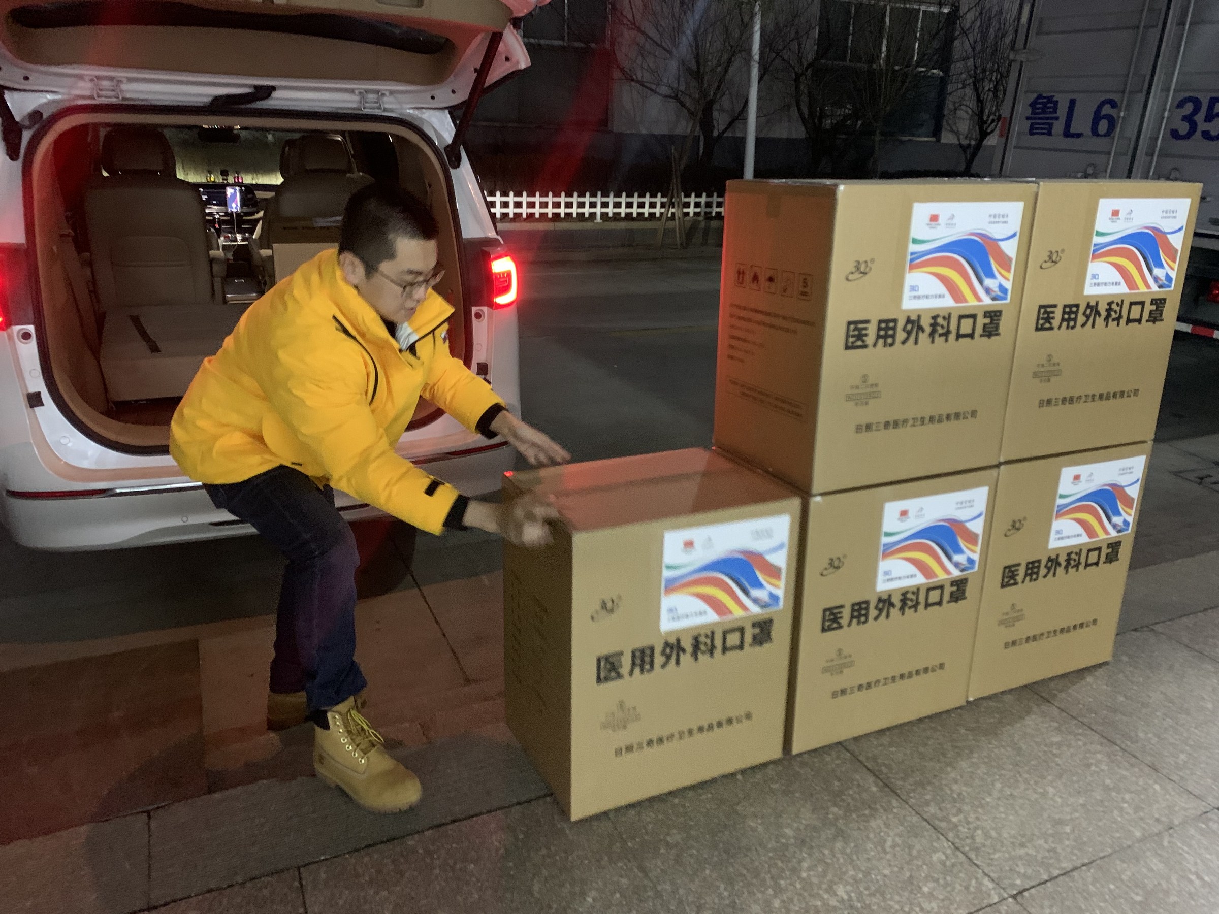 Cartons of medical masks being prepared for snow-wax vehicle support